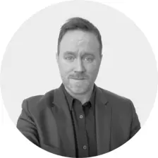Black and white headshot of Dan Harrigan