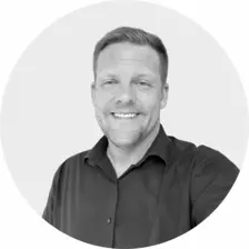 Black and white headshot of Dean Wildman
