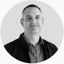 Black and white headshot of Andrew Moran