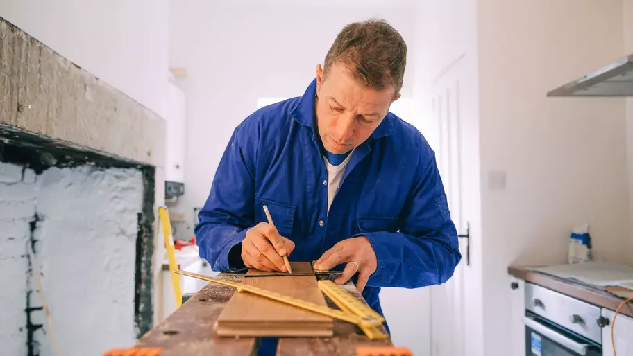 independent contractor working in a kitchen