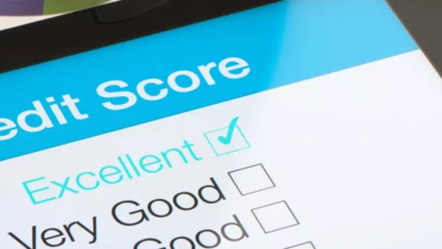 Credit score on a digital tablet with desk background