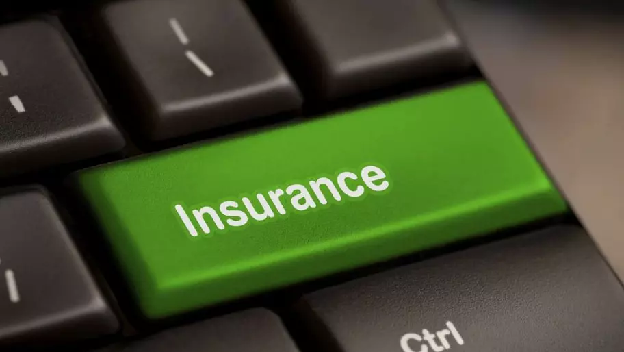 a computer keyboard with insurance replacing the enter button