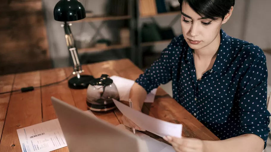 Woman sitting at desk at her laptop. Main Street Lending Program. Alternatives to the PPP.