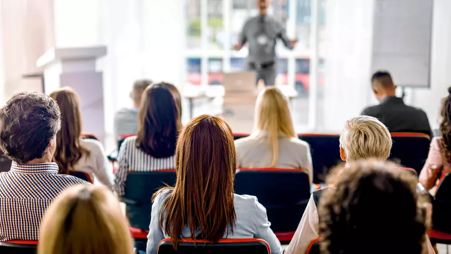 Backs of heads at a business presentation 