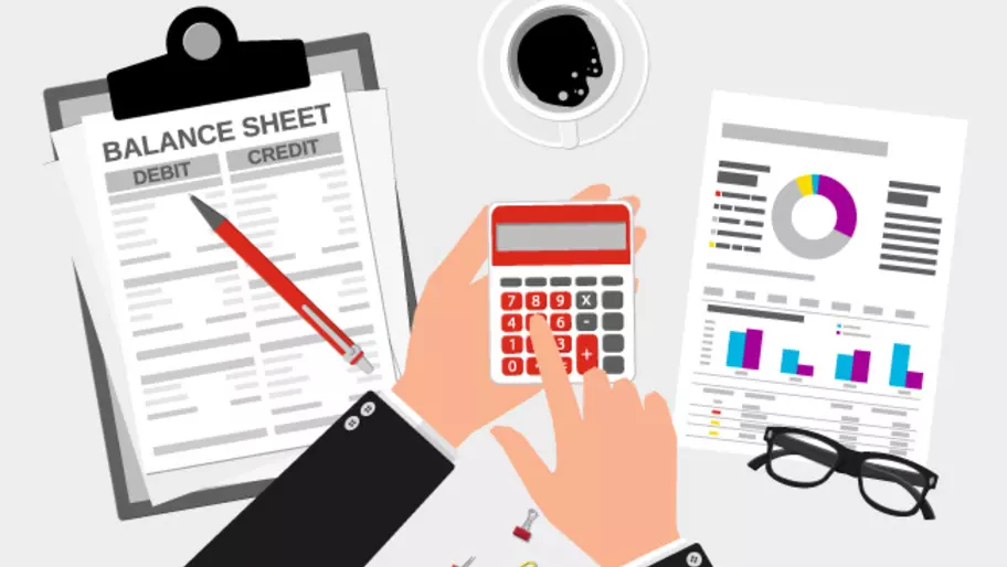 small business cash flow balance sheet with clipboard and calculator
