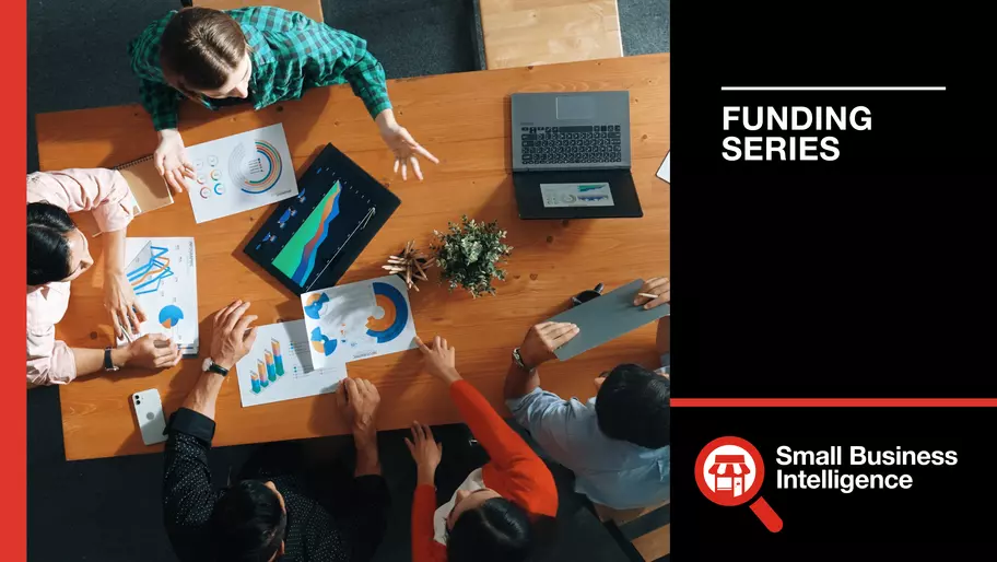 Bird's eye view of business meeting between four people, looking for an investment or funding options for small business