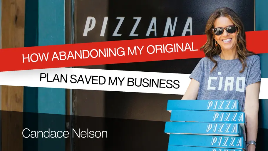 Small business owner holding pizza boxes outside shop after pivoting business plan to improve growth