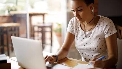 Woman on Laptop wondering about insurance coverage limits.
