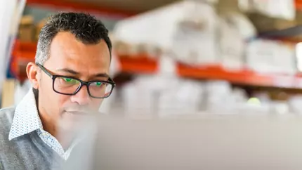 man at business on computer