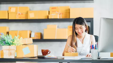 small business consultant works in her online business which has insurance 