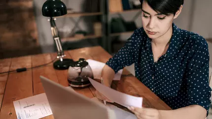 Woman sitting at desk at her laptop. Main Street Lending Program. Alternatives to the PPP.