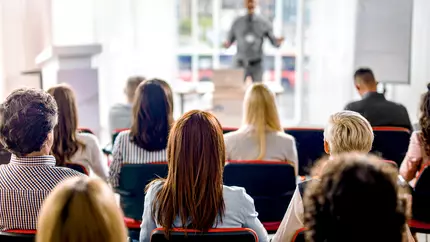 Backs of heads at a business presentation 