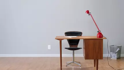 Desk, red lamp, stylish. Home office. Home-based business.