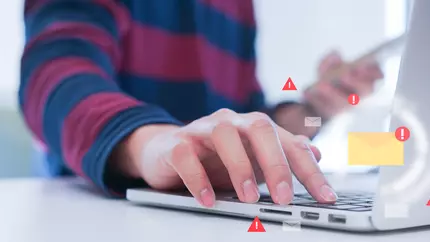 Woman's hand on laptop keyboard. Cyber icons. Error message. Top cyber risks in 2021.