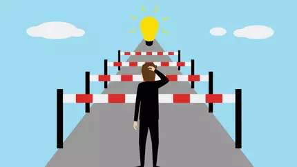 small business roadblocks man facing hurdles toward goal