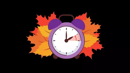 black background with orange and red leaves surrounding a clock falling back an hour to mark end of daylight saving time