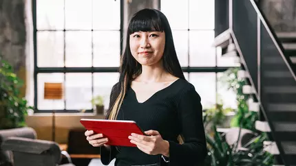 femaie business owner looking at inspirational quotes for business motivation