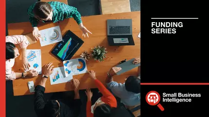 Bird's eye view of business meeting between four people, looking for an investment or funding options for small business