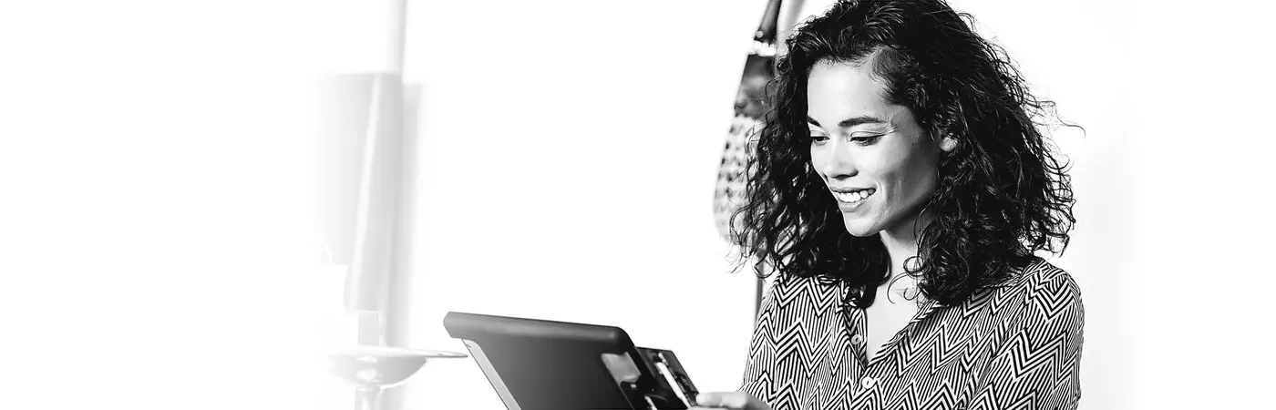 A smiling retail professional purchasing retail professional insurance