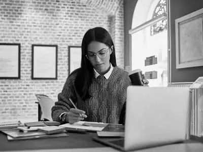 Woman with a laptop, doing work